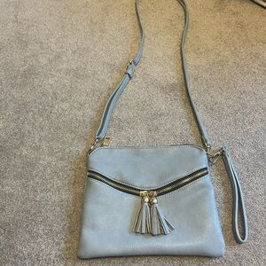 Light blue square crossbody purse with tassels